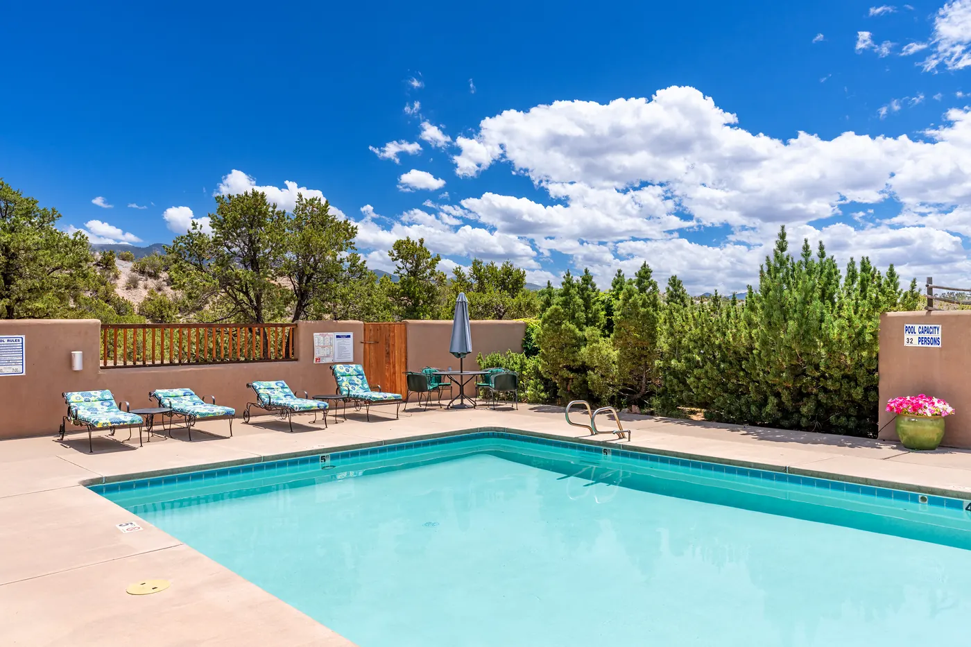 Community pool and lounge area near Casa Colibrí