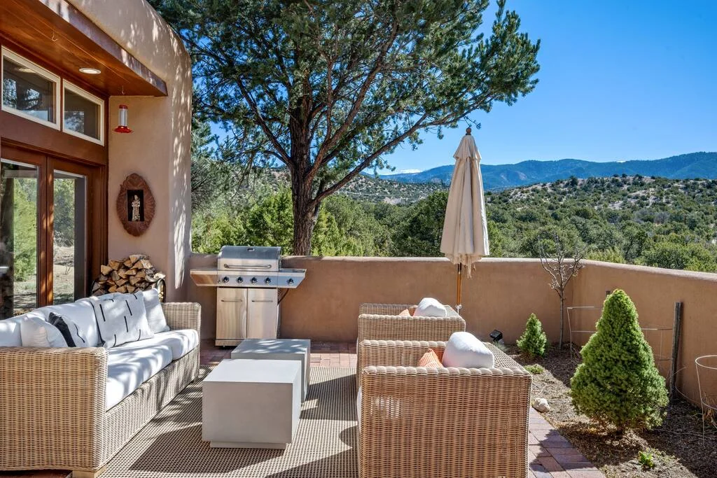 Casa Colibrí exterior with adobe architecture, patio and mountain views