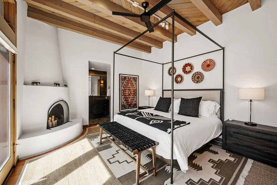 Primary bedroom with king bed and mountain views