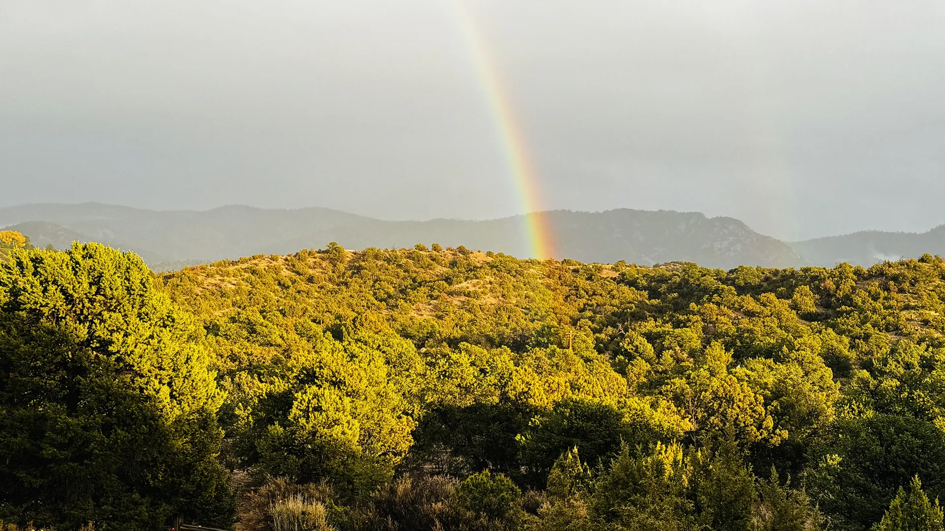 Rainbow over the Sangre de Cristo mountains from Casa Colibrí